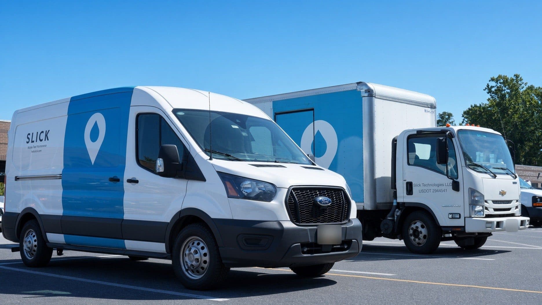 Slick-branded service van and box truck