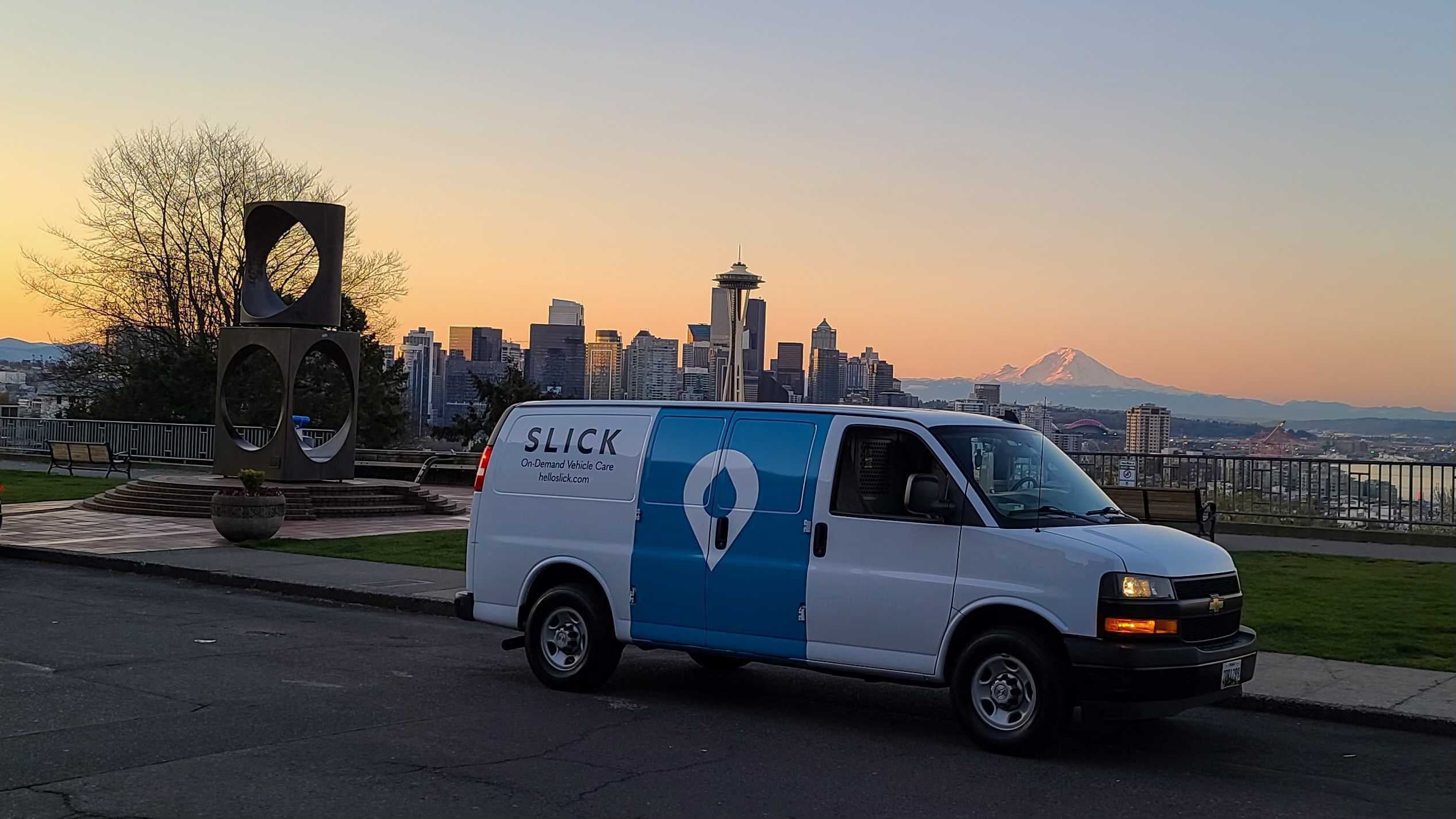 Slick service van and technician working on a fleet yard