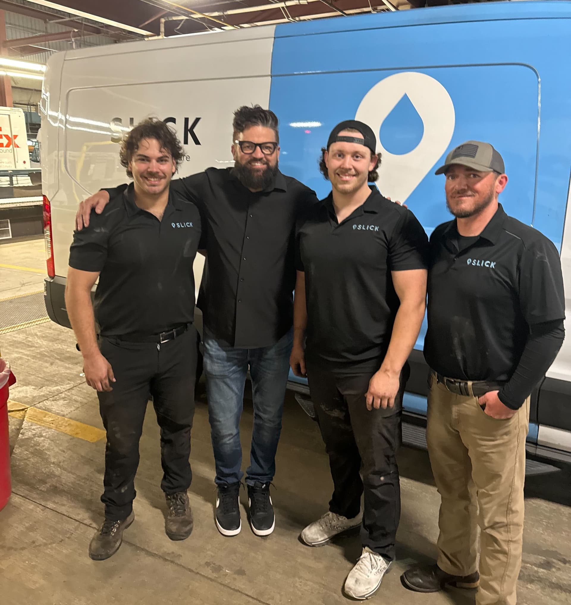 Slick technician in uniform performing fleet maintenance on-site