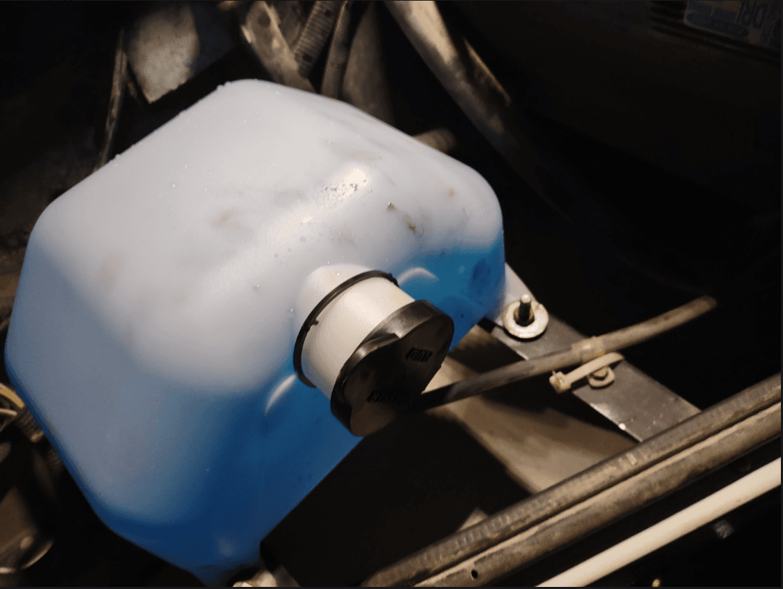 Technician photo of washer tank assembly documented in TruView during repair